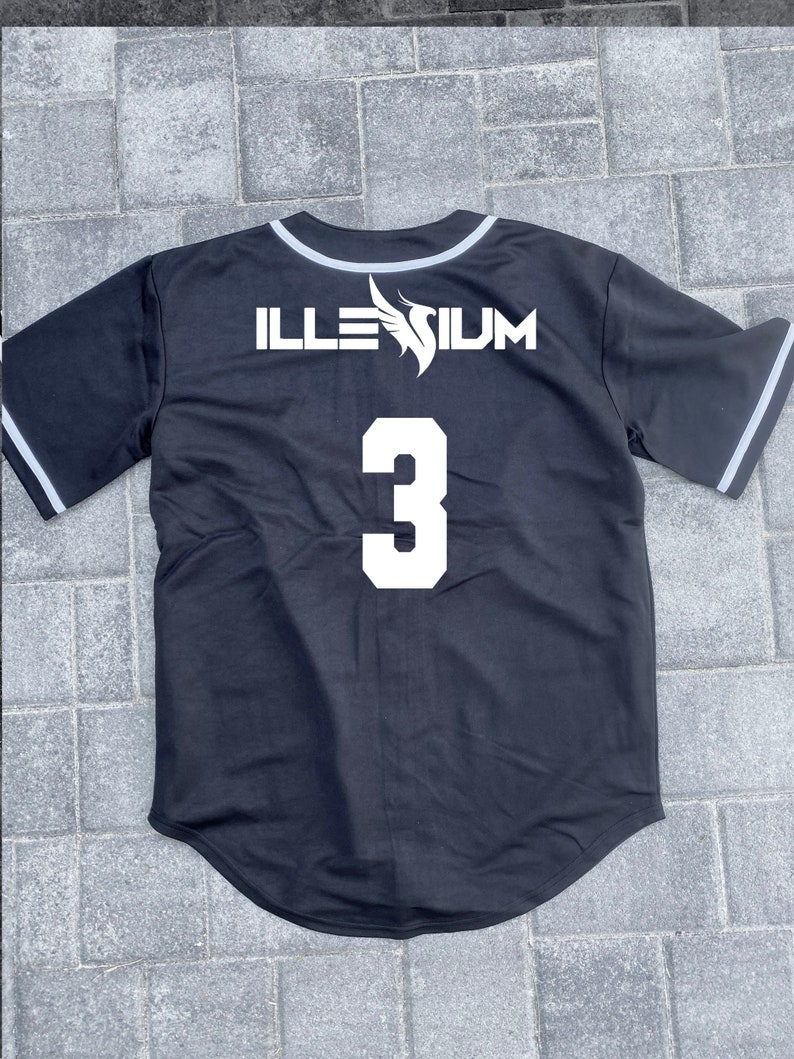 May include: Black baseball jersey with white trim and the text "ILLESIUM" and the number "3" on the back.