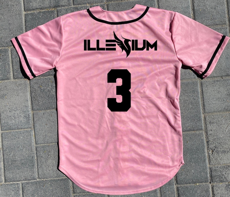 May include: Pink baseball jersey with black trim and the word "ILLESIUM" and the number "3" printed on the back.