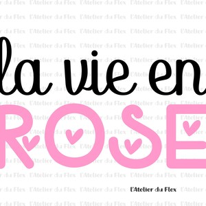 May include: A graphic design featuring the French phrase "la vie en ROSE" in black and pink. The word "ROSE" is in a large, pink font with heart shapes. The design includes the text "L'Atelier du Flex".