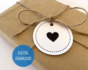 May include: A wrapped gift with a white tag featuring a black heart and dotted border, tied with twine. The gift is wrapped in brown paper. A blue circle with the words "DIGITAL DOWNLOAD" is in the lower left corner.