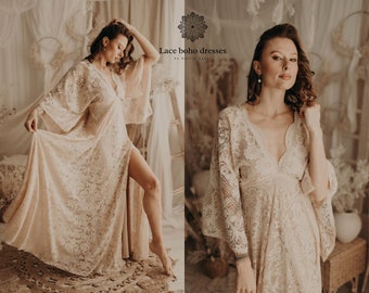 May include: A woman wearing a long, white lace dress with a deep V-neckline and bell sleeves. The dress has a slit up the front and is made of delicate lace fabric. The dress is perfect for a special occasion or a wedding.