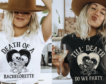 May include: Two women wearing t-shirts with a skull and crossbones graphic. The white t-shirt says "Death of a 2023 Bachelorette" and the black t-shirt says "Till' Death 2023 Do We Party".