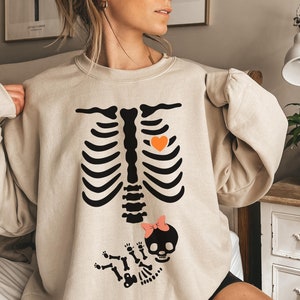 Skeleton Halloween Maternity Sweatshirt, New Baby Girl Pregnancy Announcement Shirt 2024, Pregnant Women Costume, Mom Sweater, Mama to Be