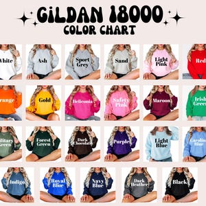 K&ouml;nnte beinhalten: Farbkarte f&uuml;r Gildan 18000 Sweatshirts, die 18 verschiedene Farben zeigt, darunter Wei&szlig;, Asche, Sportgrau, Sand, Hellrosa, Rot, Orange, Gold, Heliconia, Sicherheitsrosa, Maroon, Irischgr&uuml;n, Milit&auml;rgr&uuml;n, Waldgr&uuml;n, Dunkelbraun, Lila, Hellblau, Carolina Blau, Indigo, K&ouml;nigsblau, Marineblau, Dunkelgrau meliert und Schwarz.