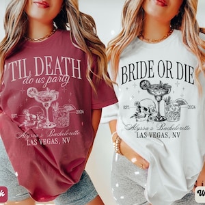 May include: Two white t-shirts with black text and graphics. The left shirt says "Til Death Do Us Party" and the right shirt says "Bride or Die". Both shirts feature a skull, a margarita glass, and a cocktail glass. The text "Alyssa's Bachelorette Las Vegas, NV" is on both shirts.