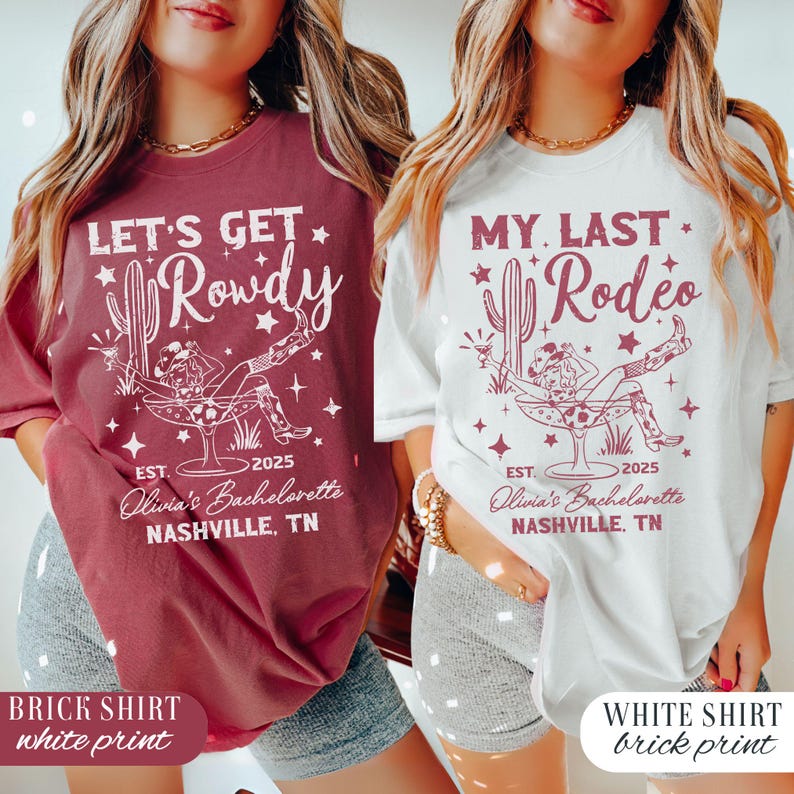May include: Two white t-shirts with a cactus and a woman in a cowboy hat design. The text on the shirts reads "Let's Get Rowdy" and "My Last Rodeo". The shirts are printed with a brick red color.