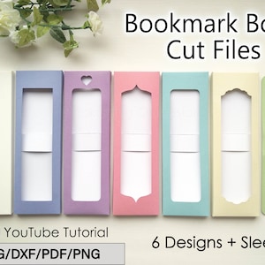 Può includere: Sei file di taglio per scatole di segnalibri colorati, ciascuno con un design a finestra unico. Le scatole sono in tonalità crema, lavanda, rosa, verde acqua e giallo. L'immagine include anche un segnalibro con una nappa dorata e il testo "Bookmark Box Cut Files".