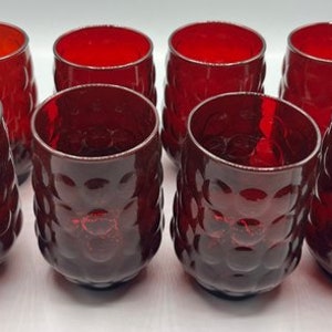 May include: Set of eight red glass tumblers with a textured bubble design.