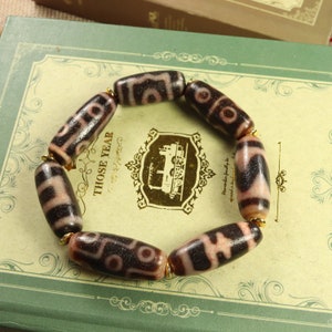 Tibetan Three Eye, Six Eye, Heaven and Earth, Nine Eye, Nectar Vessel, Tiger Tooth, Eight Eye Dzi Bead Bracelet