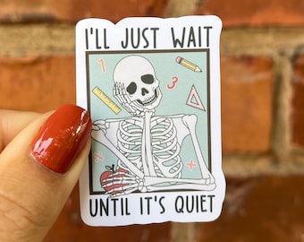 May include: A white sticker with a cartoon skeleton sitting with a pencil and ruler. The text on the sticker reads "I'll just wait until it's quiet."