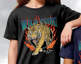 May include: Two children wearing black and navy blue t-shirts with a tiger graphic and the text "Wild Thing" and "Rock Tour 1967".