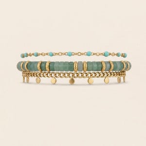 May include: Three stacked bracelets. The top bracelet is a delicate gold chain with small turquoise beads. The middle bracelet features green beads with gold accents. The bottom bracelet is a gold chain with small gold disc charms.
