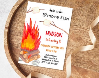 May include: A campfire birthday party invitation with a watercolor illustration of a campfire with flames, marshmallows on sticks, and the text "Join us for S'more Fun, Hudson is turning 8, Saturday October 21st from 4 PM, Hudson's House 34567 Campfire Dr Marshmallow, Tx 75000 RSVP to 123-456-7890".