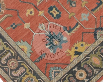May include: Close-up of a section of a red oriental rug with a detailed floral pattern. The rug features a dark border with floral and geometric designs in shades of yellow, blue, and green. The center has a medallion design.