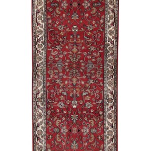 May include: A red runner rug with a cream-colored border and intricate floral patterns. The rug has a traditional Persian design with a central medallion and repeating motifs.