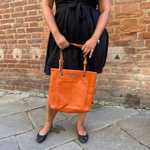 Calvin Klein orange leather Tote bag.
