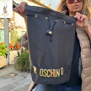 Moschino bucket bag  1990s vintage canvas hobo bag gold logo fittings.