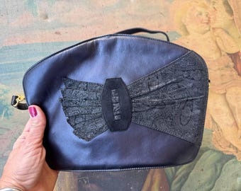 Black leather clutch Paolo Colcona 1980s with suede bow, elegant italian purse.