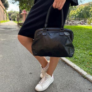 Vintage black leather clutch purse , elegant hand bag for women.