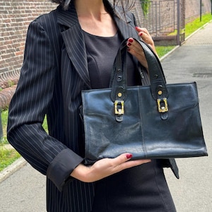 Vintage black leather bag 1980s. Elegant clutch handbag. Made in Italy.