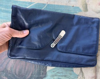 Vintage leather clutch bag 1980s with assumetric clasp. Italian handbag.