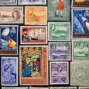 May include: A selection of Antigua postage stamps, displaying portraits, historical events, and landscapes. The stamps feature various denominations and dates, with vibrant colours and intricate designs. The stamps are arranged on a black background.