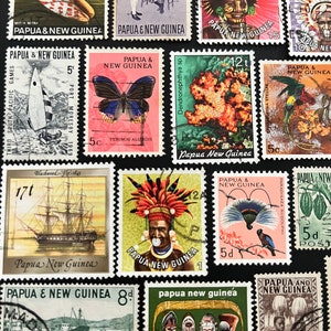 May include: A collection of vintage postage stamps from Papua New Guinea. The stamps feature a variety of designs, including a seashell, a butterfly, a bird of paradise, and a traditional tribal mask. The stamps are in excellent condition and would be a great addition to any stamp collection.