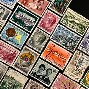 May include: A collection of vintage postage stamps from Luxembourg. The stamps feature various designs, including a building, a lion, a tree, and a portrait of a woman. The stamps are in different colors and sizes.