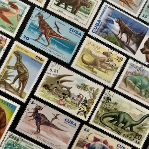 May include: A collection of vintage postage stamps featuring colorful illustrations of prehistoric animals, including dinosaurs, pterosaurs, and other extinct creatures. The stamps are from various countries, including Cuba, DPR Korea, and Sahara OCC. R.A.S.D.
