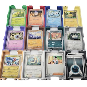 May include: A multi-colored card organizer with various Pok&eacute;mon trading cards. The organizer has multiple compartments in green, red, blue, yellow, purple, orange, teal, and gray. Each compartment holds several cards, showcasing different Pok&eacute;mon characters and card designs.