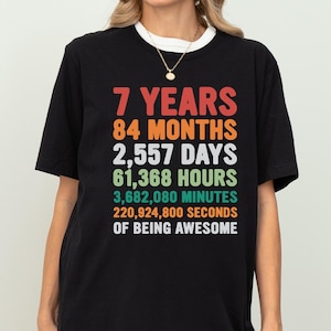 May include: A set of three ceramic mugs with a speckled, matte finish. The mugs are in shades of cream, light gray, and dark gray. Each mug has a simple, minimalist design, perfect for coffee or tea.