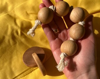 Disks Montessori, Grasping bead