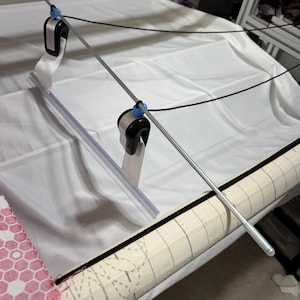 After releasing the clamps, it secures them and prevents them from falling to the floor.