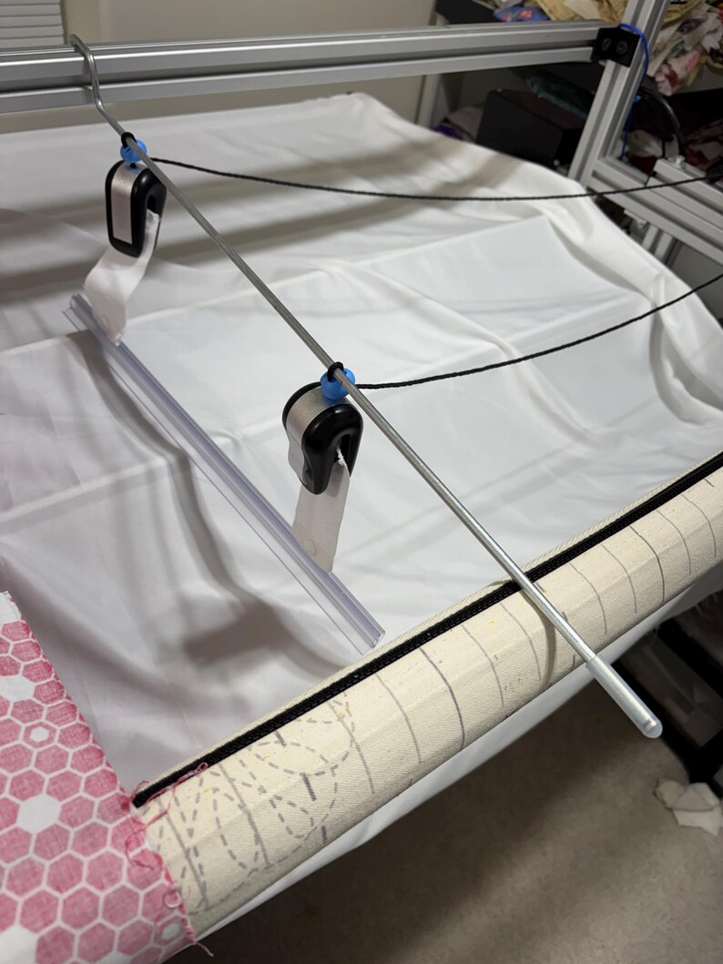 After releasing the clamps, it secures them and prevents them from falling to the floor.