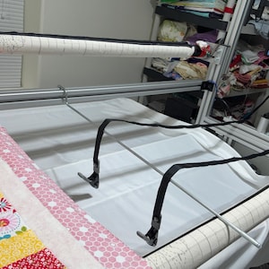 After releasing the clamps, it secures them and prevents them from falling to the floor.