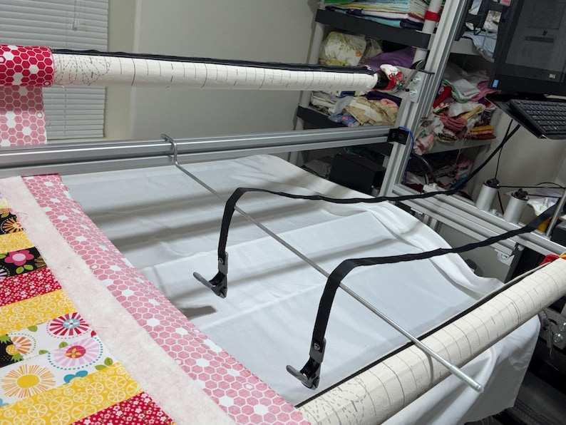 After releasing the clamps, it secures them and prevents them from falling to the floor.