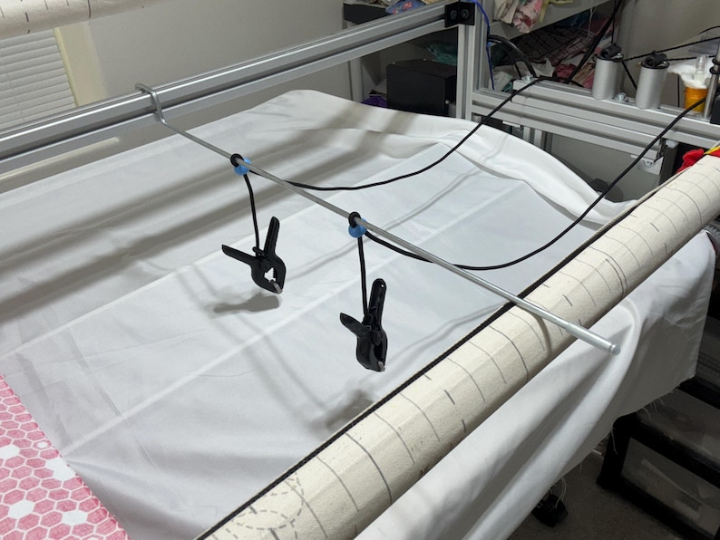 After releasing the clamps, it secures them and prevents them from falling to the floor.