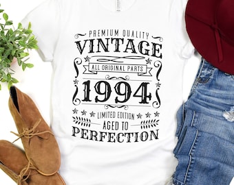 May include: White t-shirt with black text that reads "Premium Quality Vintage All Original Parts 1994 Limited Edition Aged to Perfection".
