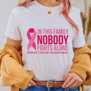 In This Family No One Fights Alone Breast Cancer Awareness T-Shirt, Pink Ribbon Tee, Cancer Survivor & Fighter Walk Gift