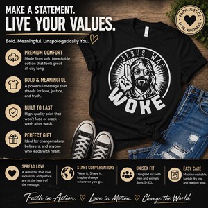 May include: A black t-shirt featuring a white graphic of a bearded figure wearing round glasses with the text JESUS WAS WOKE in a circular design. The shirt is paired with blue denim jeans and black and white canvas sneakers on a wooden surface.