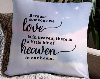 May include: A square decorative pillow with a sky-themed design. The pillow features the text "Because someone we love is in heaven, there is a little bit of heaven in our home." The background has a soft, cloudy appearance with stars.