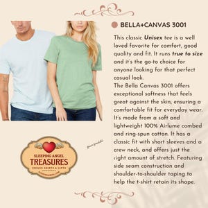 May include: A light blue t-shirt and a sage green t-shirt, both with short sleeves and crew necks. The image includes text describing the Bella+Canvas 3001 model, noting features like side seam construction, shoulder-to-shoulder taping, and 100% Airlume combed and ring-spun cotton fabric. A logo for Sleeping Angel Treasures is also visible.