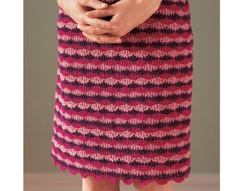May include: A pink and purple crocheted skirt with a scalloped hem.
