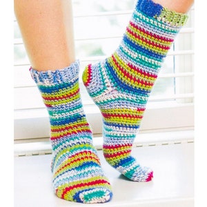 May include: A pair of colorful striped crochet socks in shades of blue, green, red, and white.