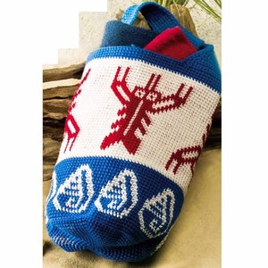 May include: A white crocheted tote bag with a blue and white trim. The bag features a red and white geometric design of a stylized lobster. The bag is filled with folded blue and red fabric.