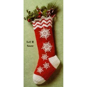 May include: Red and white crocheted Christmas stocking with a white snowflake design and the text "Let It Snow".