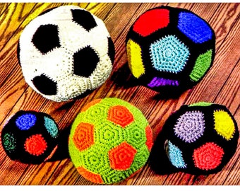May include: Five crocheted soccer balls in various colors, including black, white, red, blue, green, yellow, orange, and purple. The balls are arranged on a wooden surface.