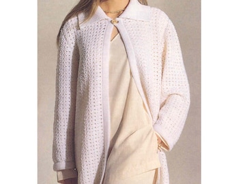 May include: White crocheted cardigan with a zipper closure and a collar. The cardigan has a delicate openwork pattern.