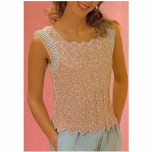 May include: A sleeveless knitted top with a scalloped neckline and a chevron pattern in shades of pink and blue.