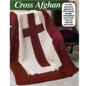 May include: A crocheted afghan blanket featuring a large cross design. The blanket is primarily cream-colored with a deep red cross in the center and a red border. The text "Cross Afghan" is at the top.